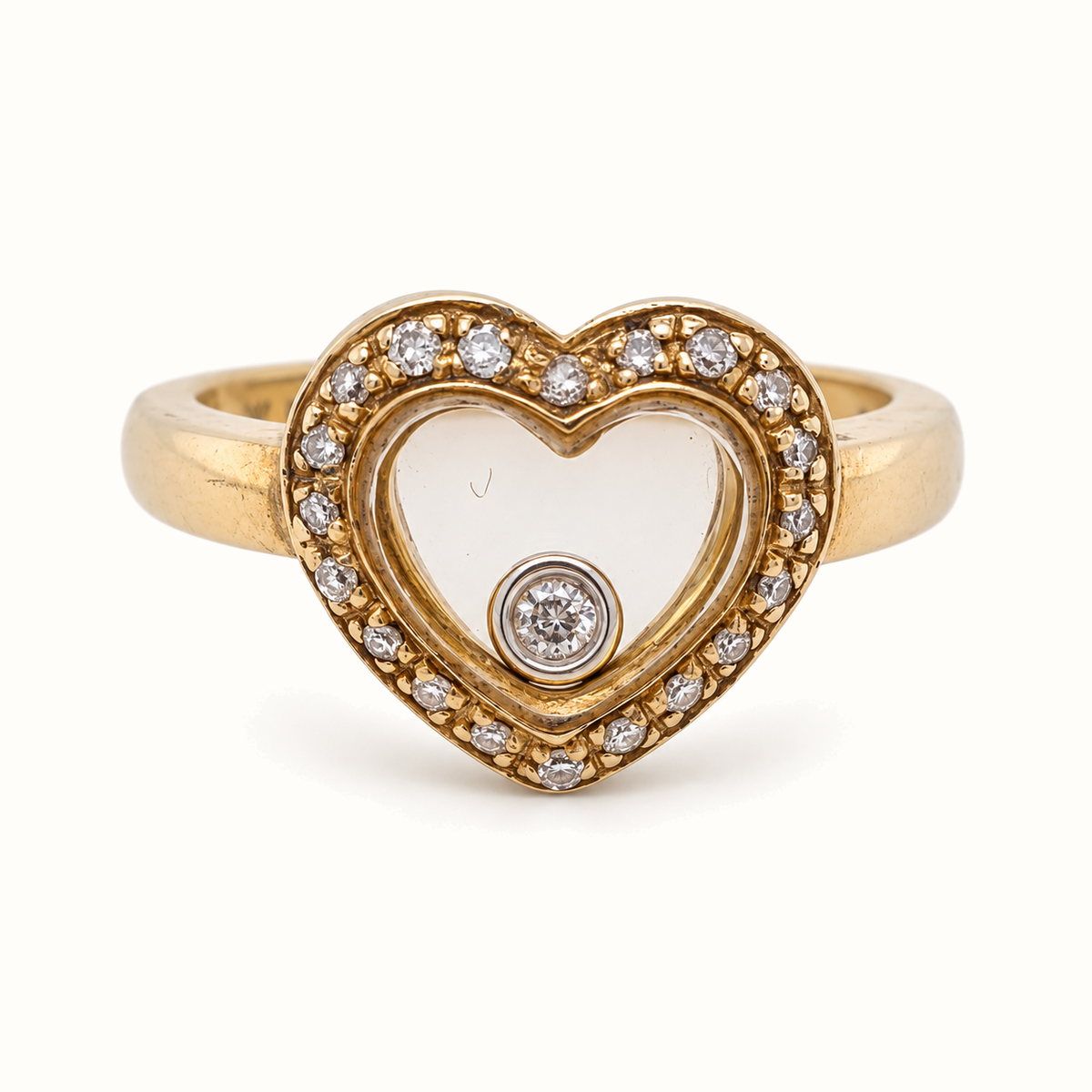 9ct Yellow Gold Floating Diamond Ring with 0.12ct diamonds, size J, on an ivory background