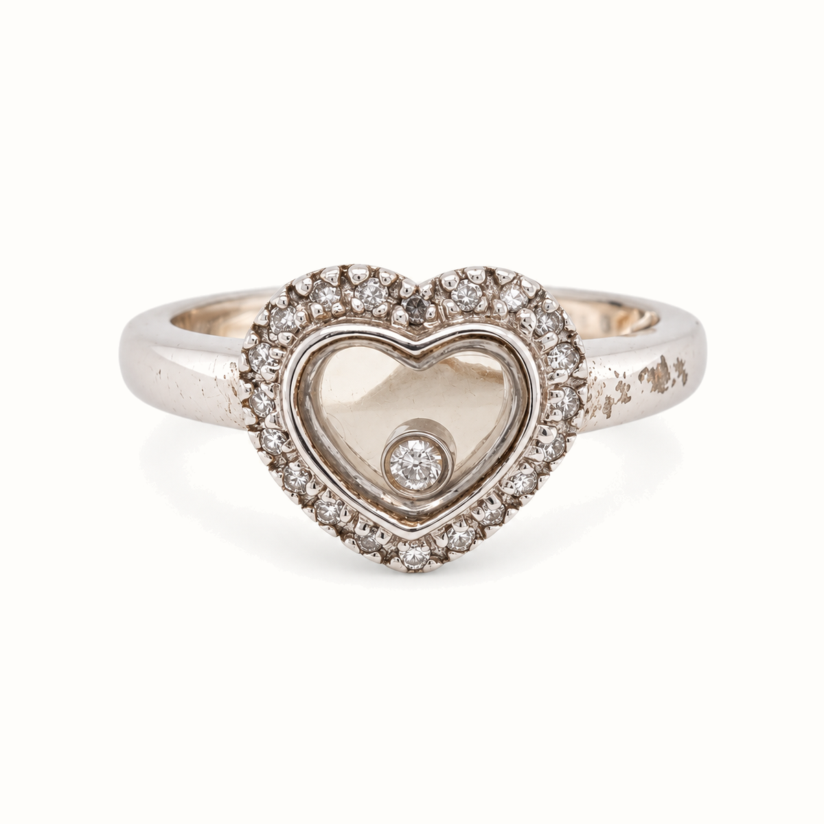 9ct White Gold Floating Diamond Ring with 0.12ct diamonds, size L, on an ivory background
