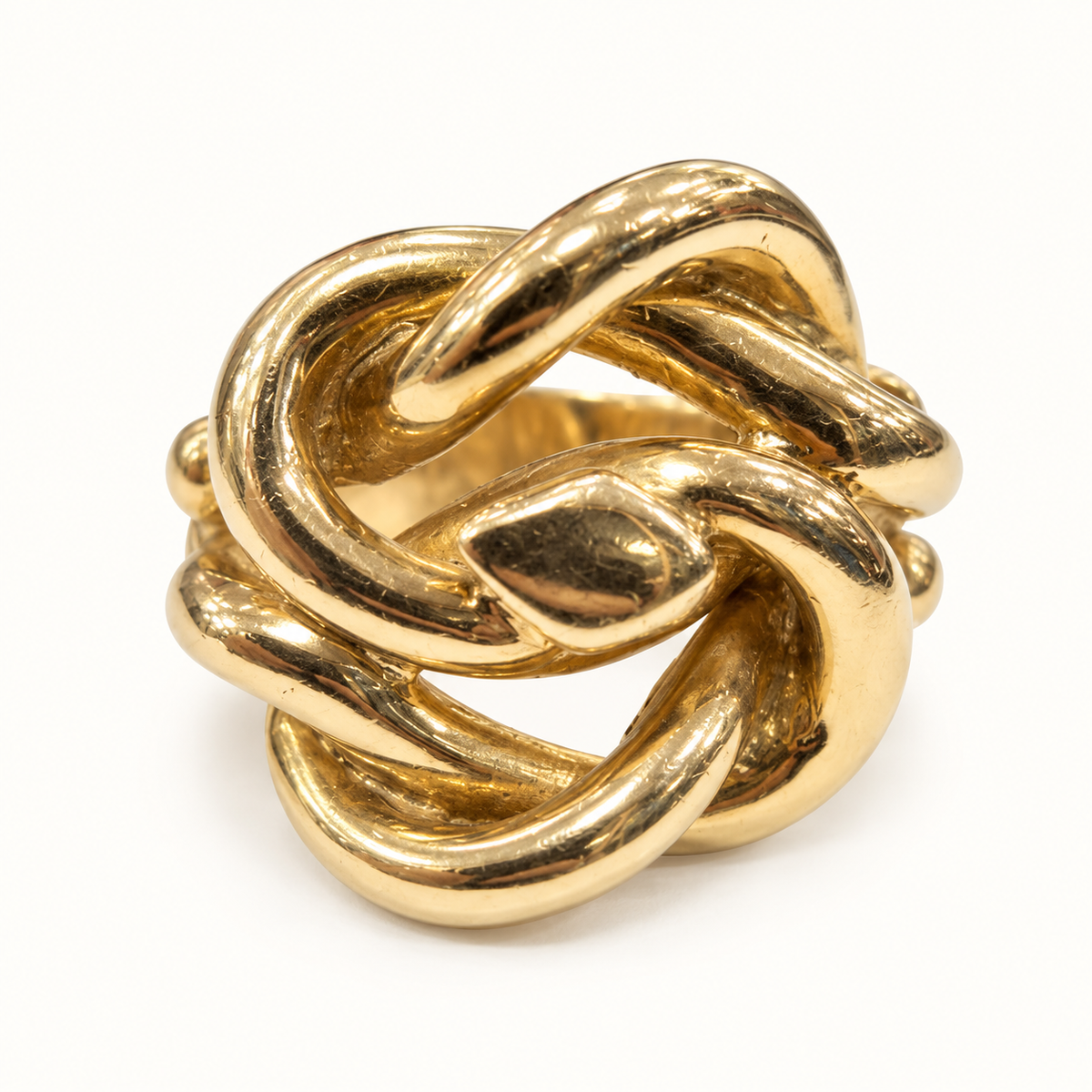 9ct gold heavy knot ring 58.4g, front angle on ivory