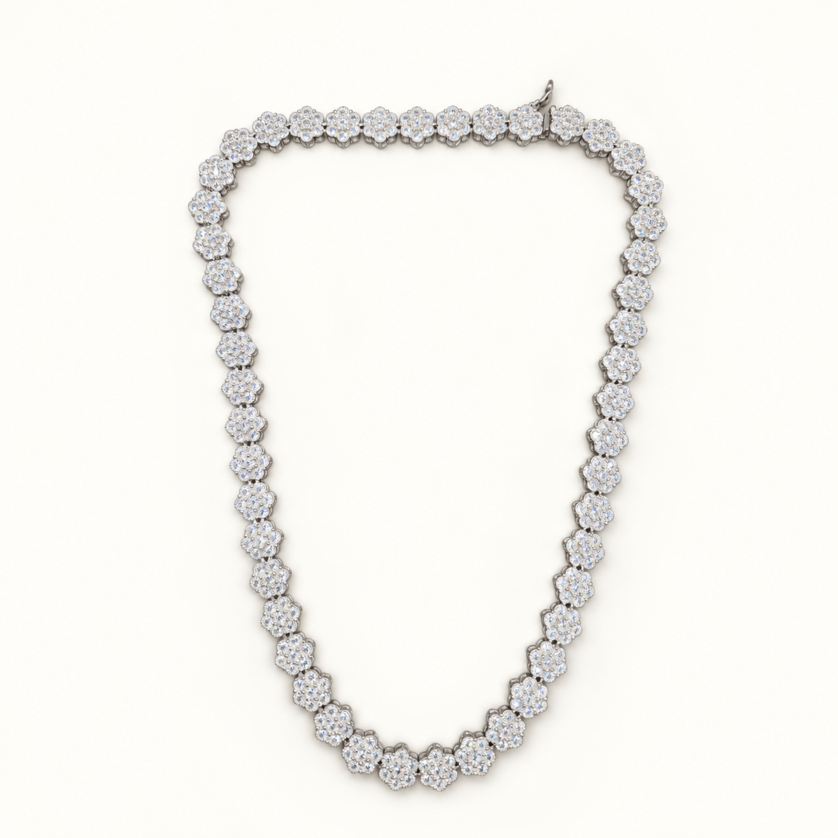 Silver Daisy tennis necklace on neutral ivory background