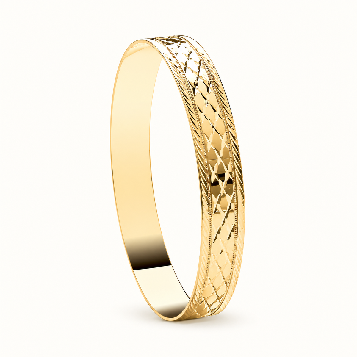 9ct yellow gold solid diamond-cut bangle, 70mm internal diameter