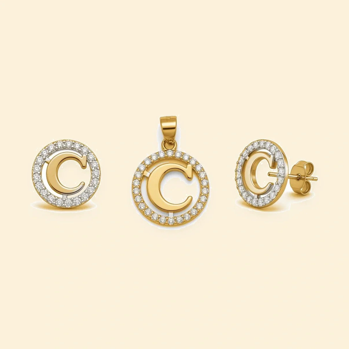 Gold plated sterling silver CZ initial C pendant set on ivory background