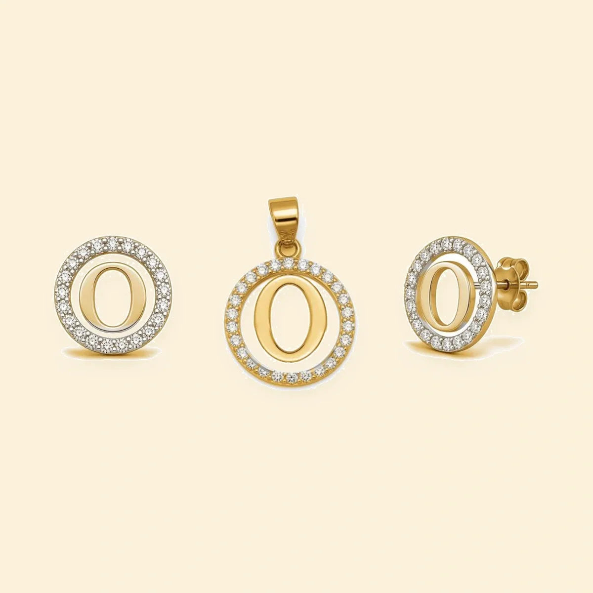 Gold plated sterling silver CZ initial O pendant set on ivory background