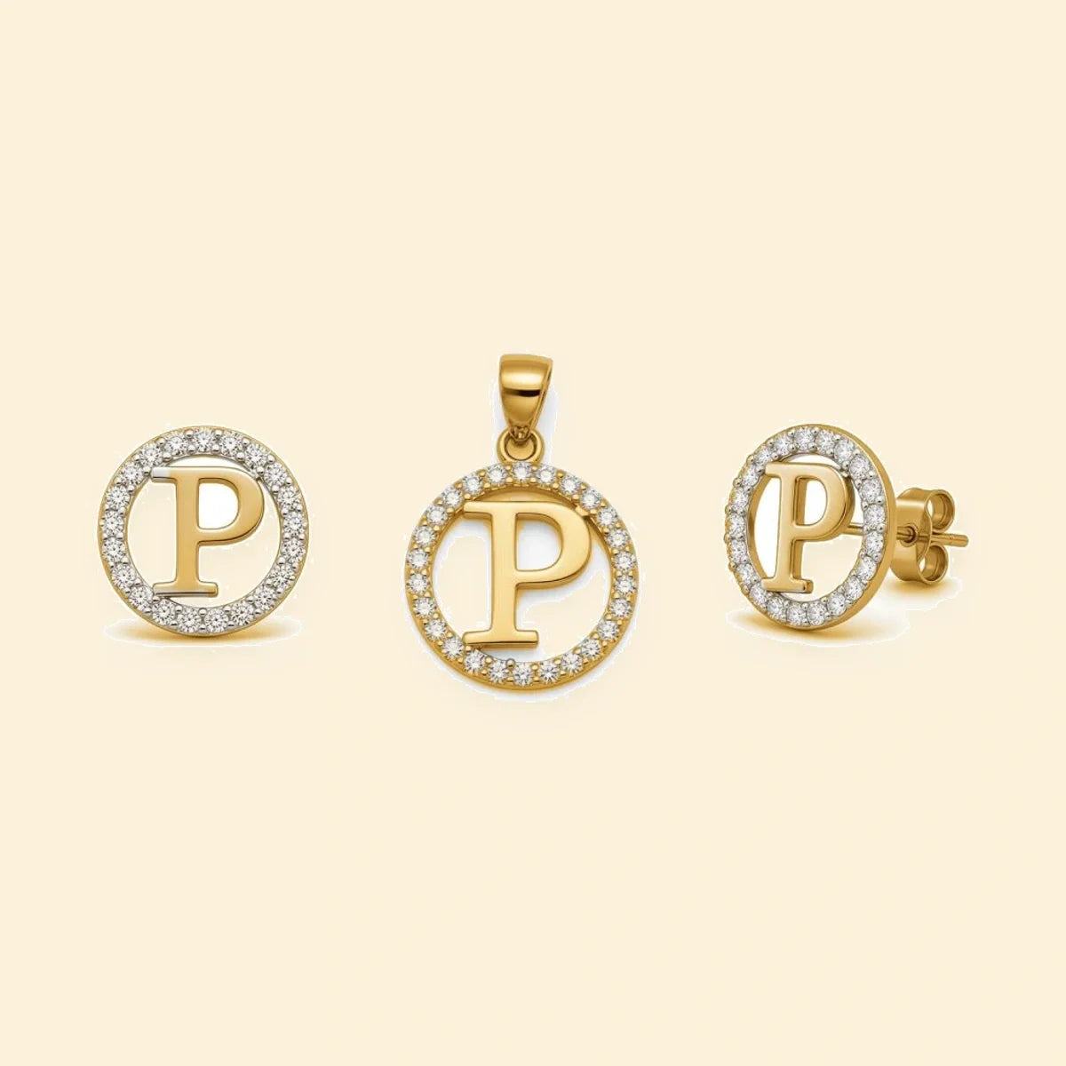 Gold plated sterling silver CZ initial P pendant set on ivory background