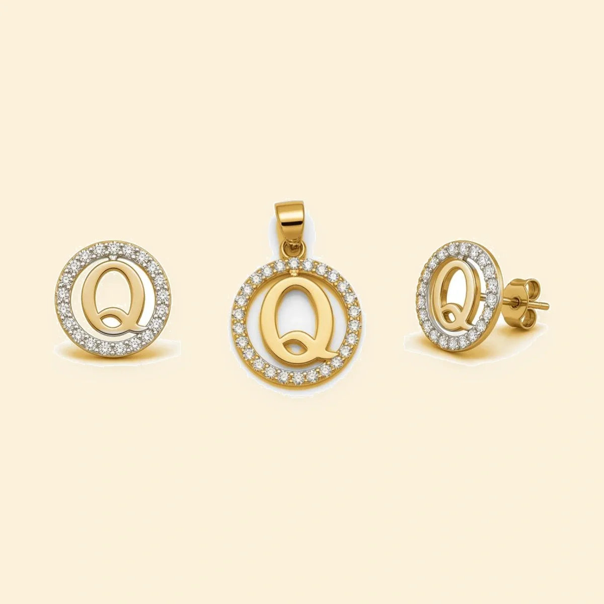 Gold plated sterling silver CZ initial Q pendant set on ivory background