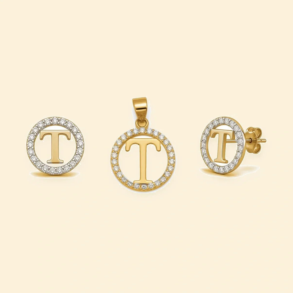 Gold plated sterling silver CZ initial T pendant set on ivory background