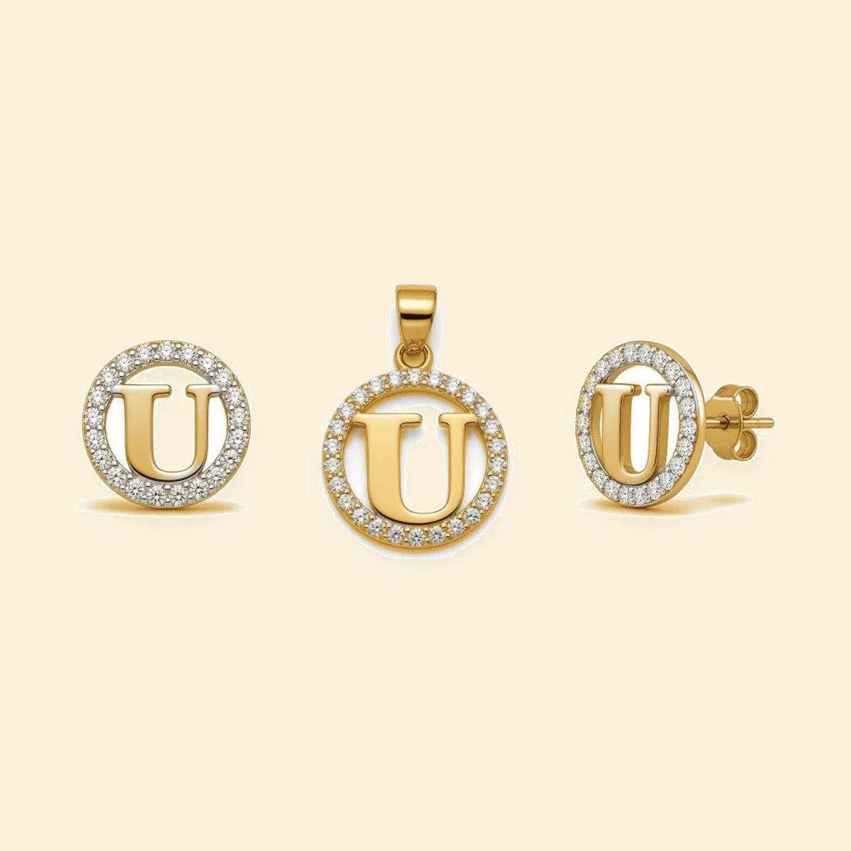Gold plated sterling silver CZ initial U pendant set on ivory background
