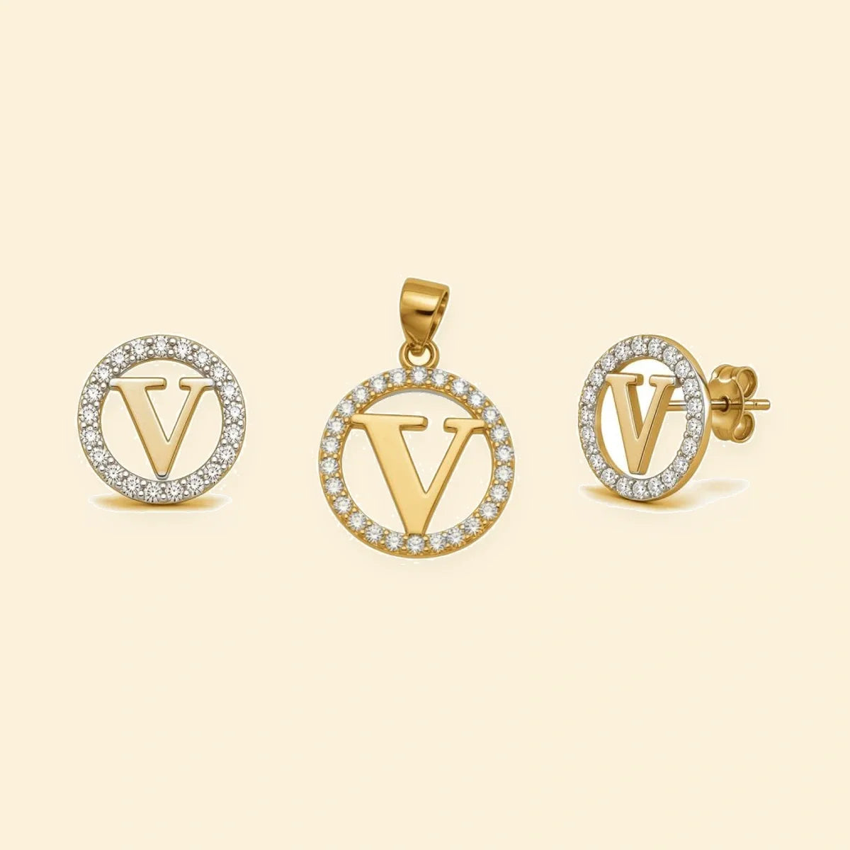 Gold plated sterling silver CZ initial V pendant set on ivory background