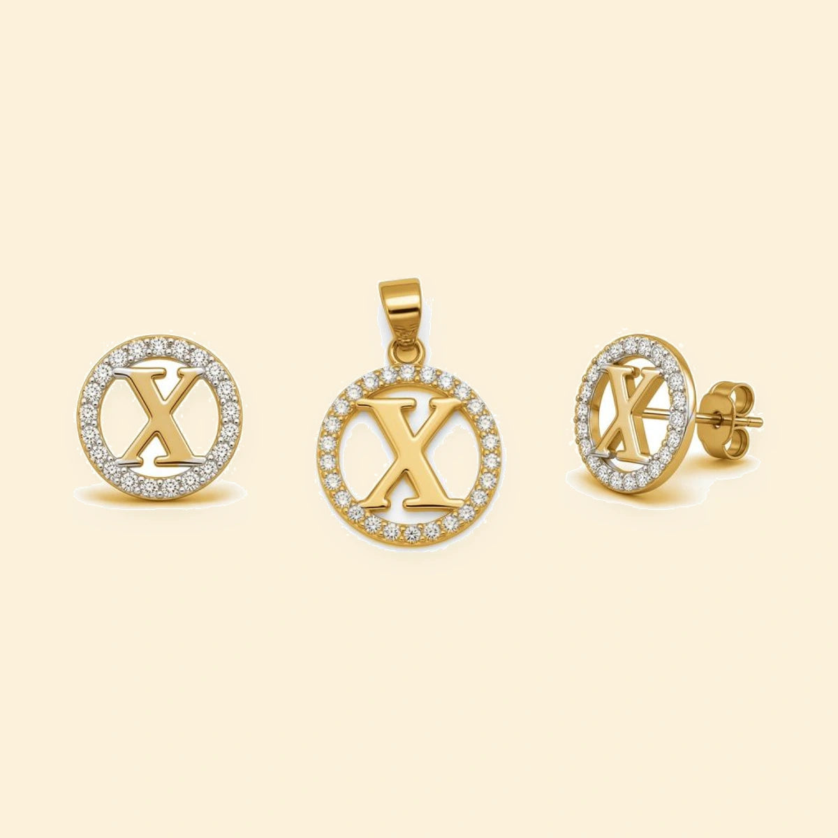 Gold plated sterling silver CZ initial X pendant set on ivory background