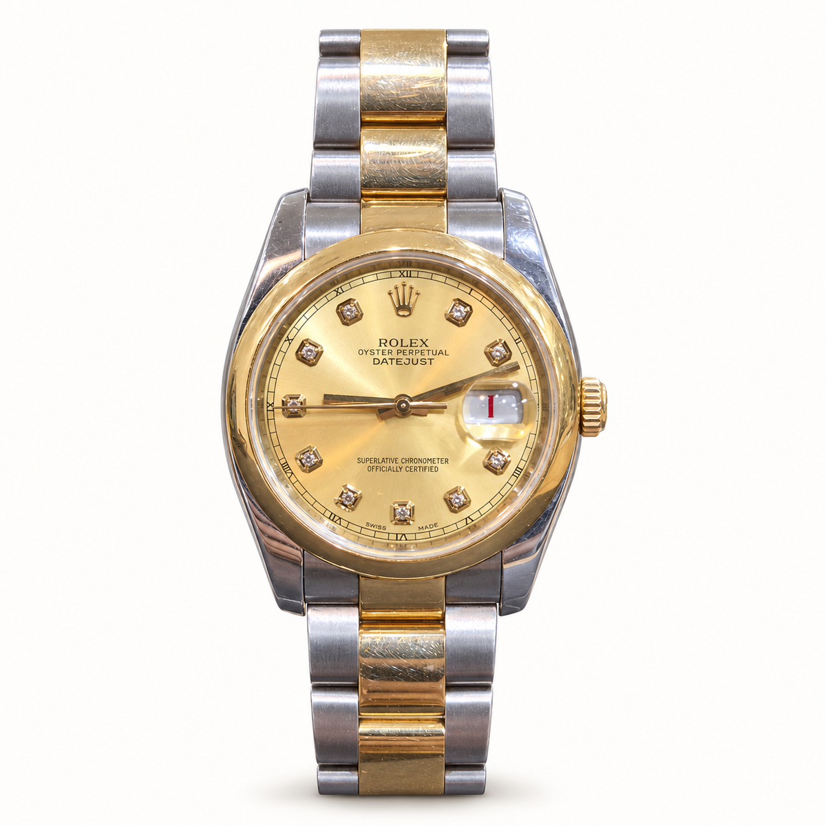 Pre-owned Rolex Datejust 116203 2009 steel and yellow gold Oyster bracelet on ivory background