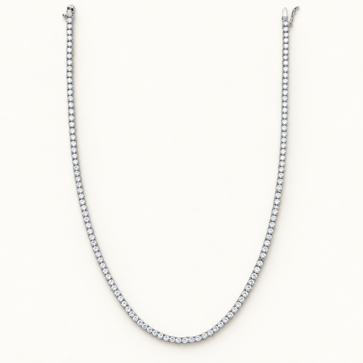 4 mm silver CZ tennis necklace on ivory background