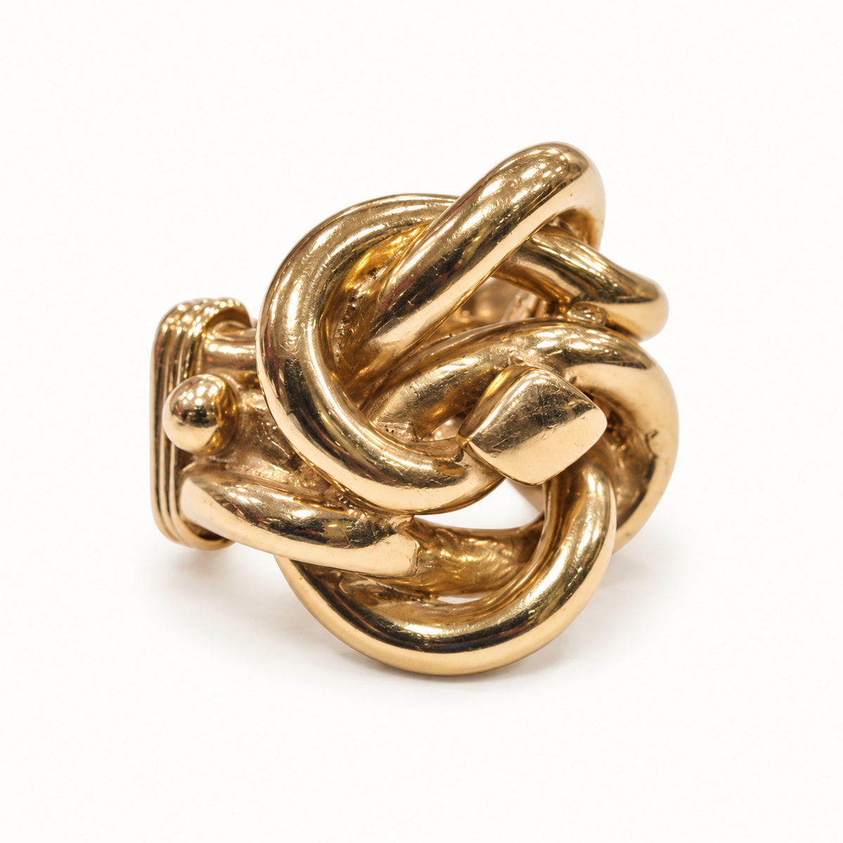 58.4g heavy gold knot ring on ivory, front view