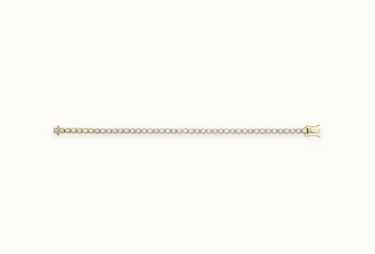 LDGBR005 9ct yellow gold lab-grown diamond tennis bracelet, full view, ivory studio background and soft shadow