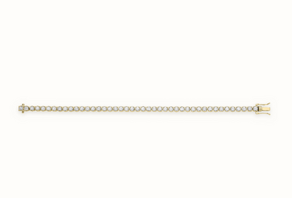 LDGBR007 9ct yellow gold lab-grown diamond tennis bracelet, full view, ivory studio background and soft shadow