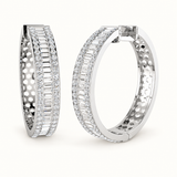 Large silver CZ hoop earrings on pale ivory