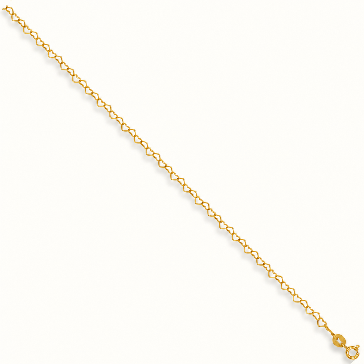 9ct yellow gold heart link anklet, 10 inch, pale ivory background