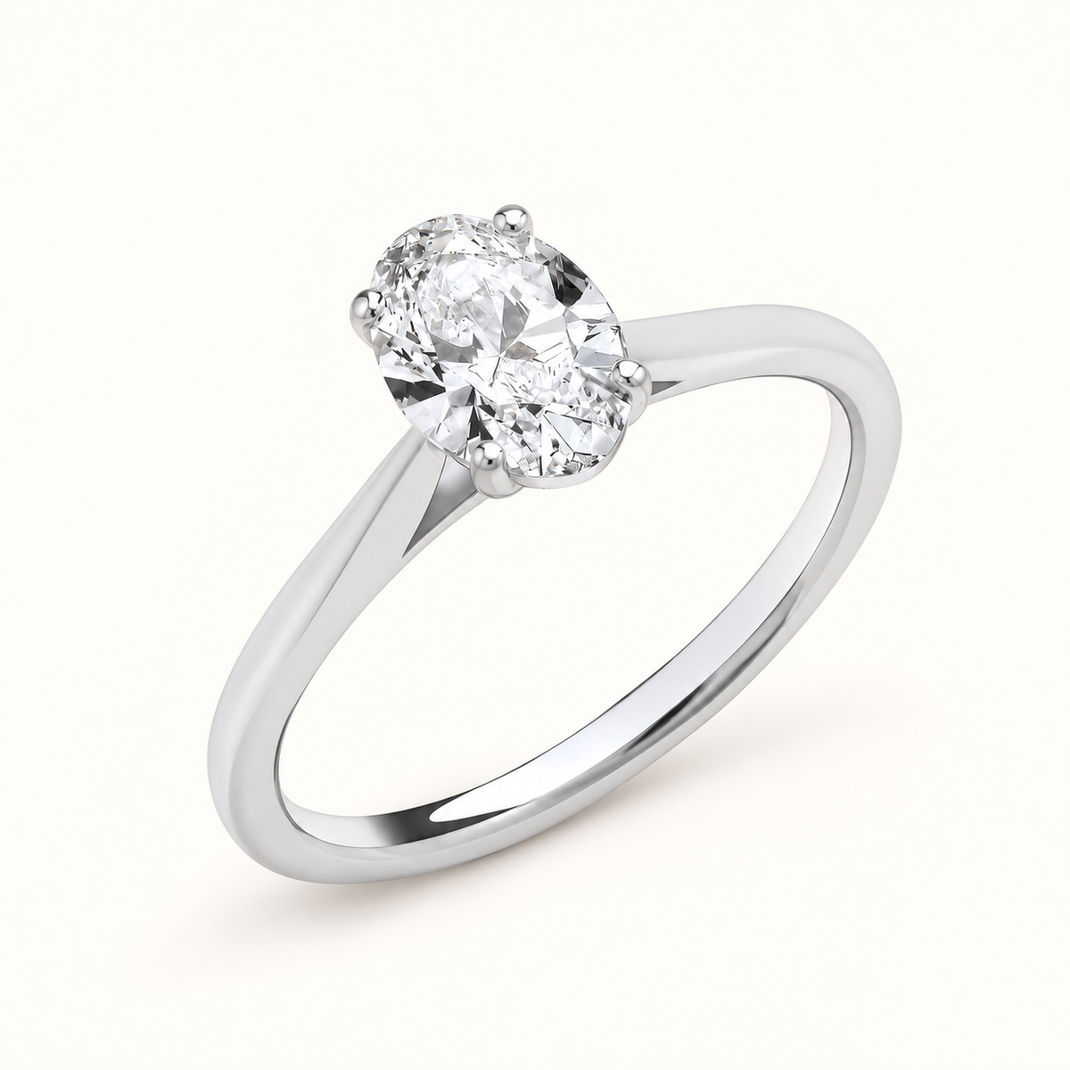 Oval-cut lab-grown diamond ring in 18ct white gold, on a pale ivory background