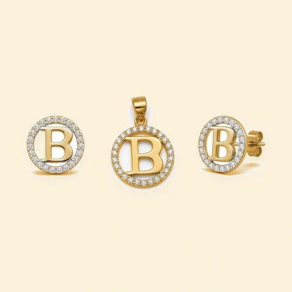 Gold plated sterling silver CZ initial B pendant set on ivory background