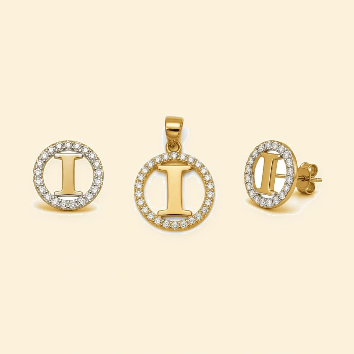 Gold plated sterling silver CZ initial I pendant set on ivory background