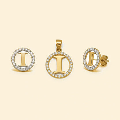Gold plated sterling silver CZ initial I pendant set on ivory background