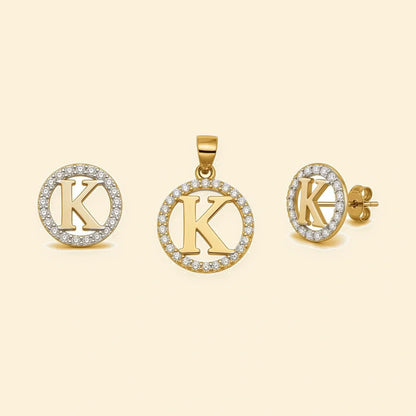 Gold plated sterling silver CZ initial K pendant set on ivory background