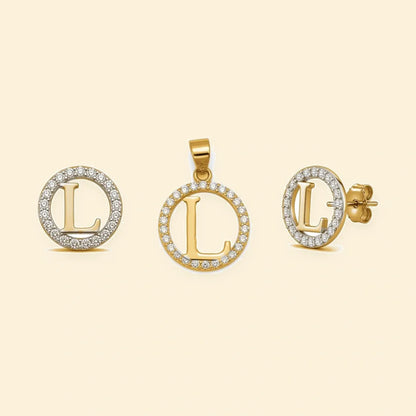 Gold plated sterling silver CZ initial L pendant set on ivory background