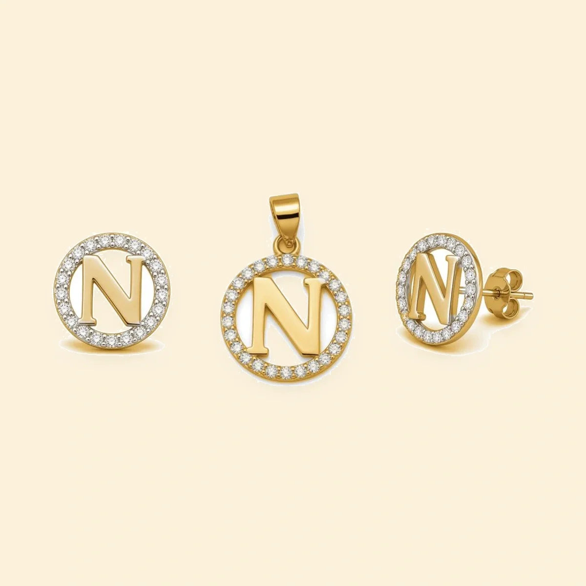 Gold plated sterling silver CZ initial N pendant set on ivory background