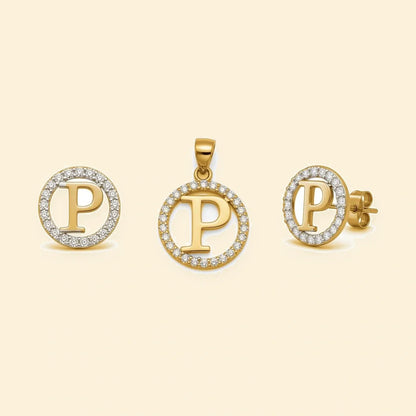Gold plated sterling silver CZ initial P pendant set on ivory background