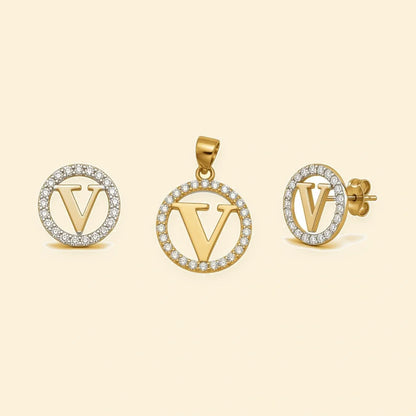 Gold plated sterling silver CZ initial V pendant set on ivory background