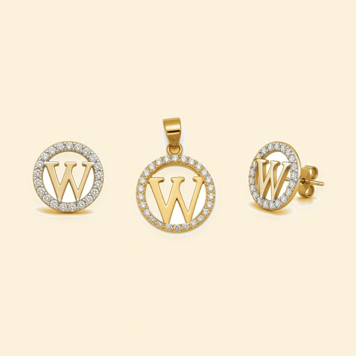 Gold plated sterling silver CZ initial W pendant set on ivory background