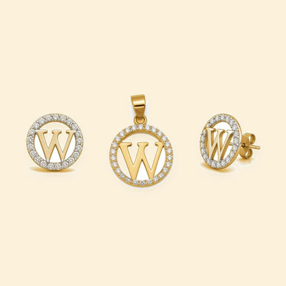 Gold plated sterling silver CZ initial W pendant set on ivory background