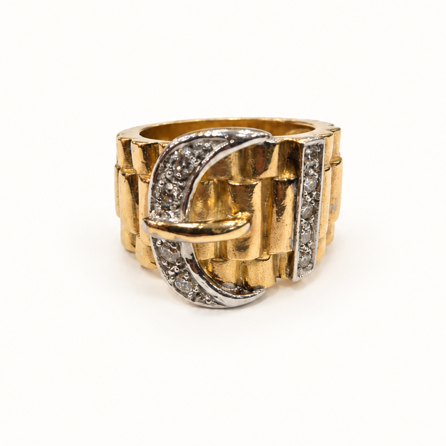 Two-tone men's buckle ring with clear stones, closer front view on pale ivory