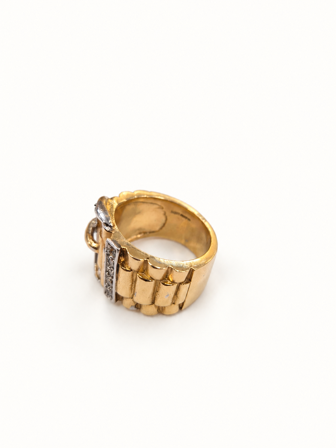 Two-tone men's buckle ring, rear view on pale ivory