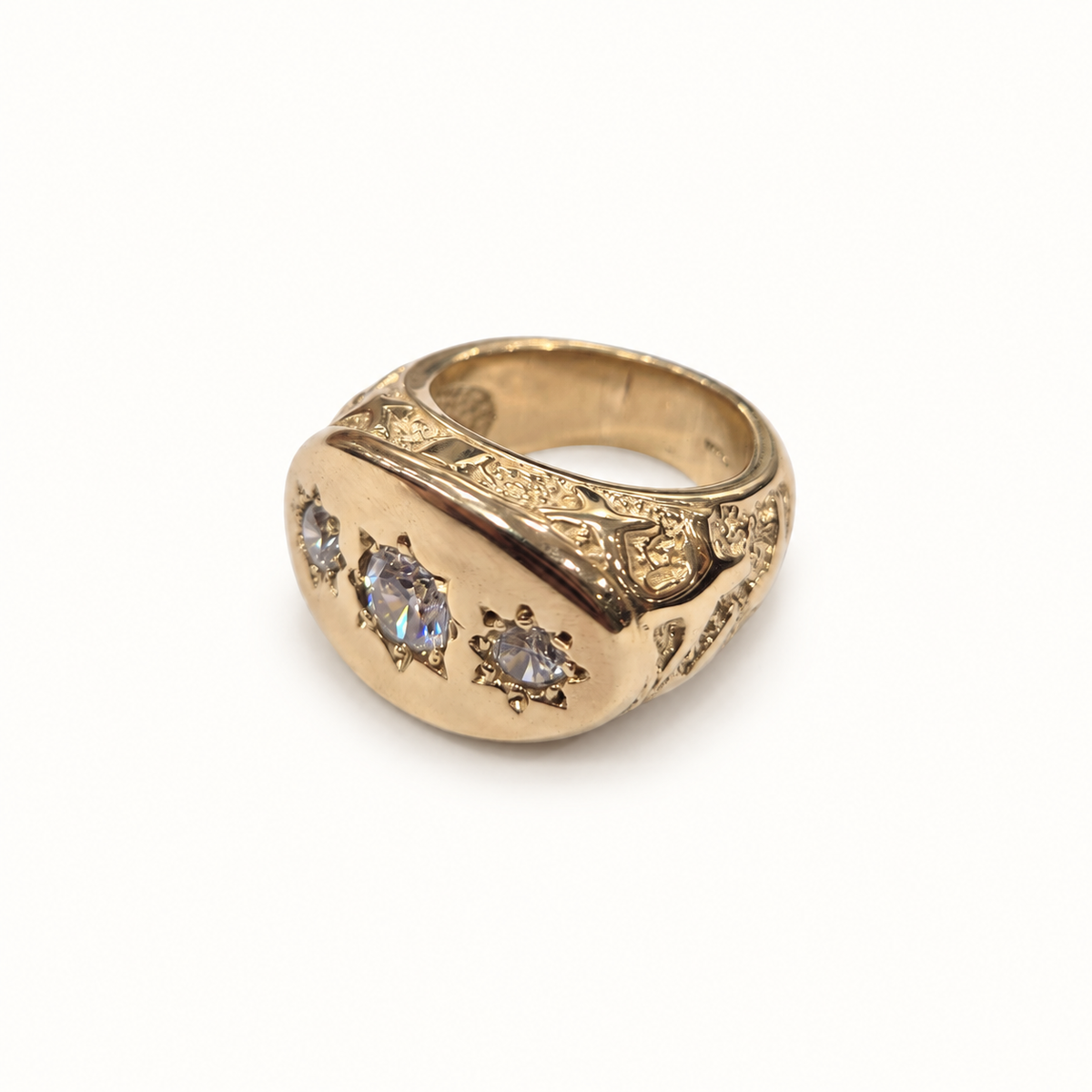 Men's 9ct yellow gold ring, angle view on ivory