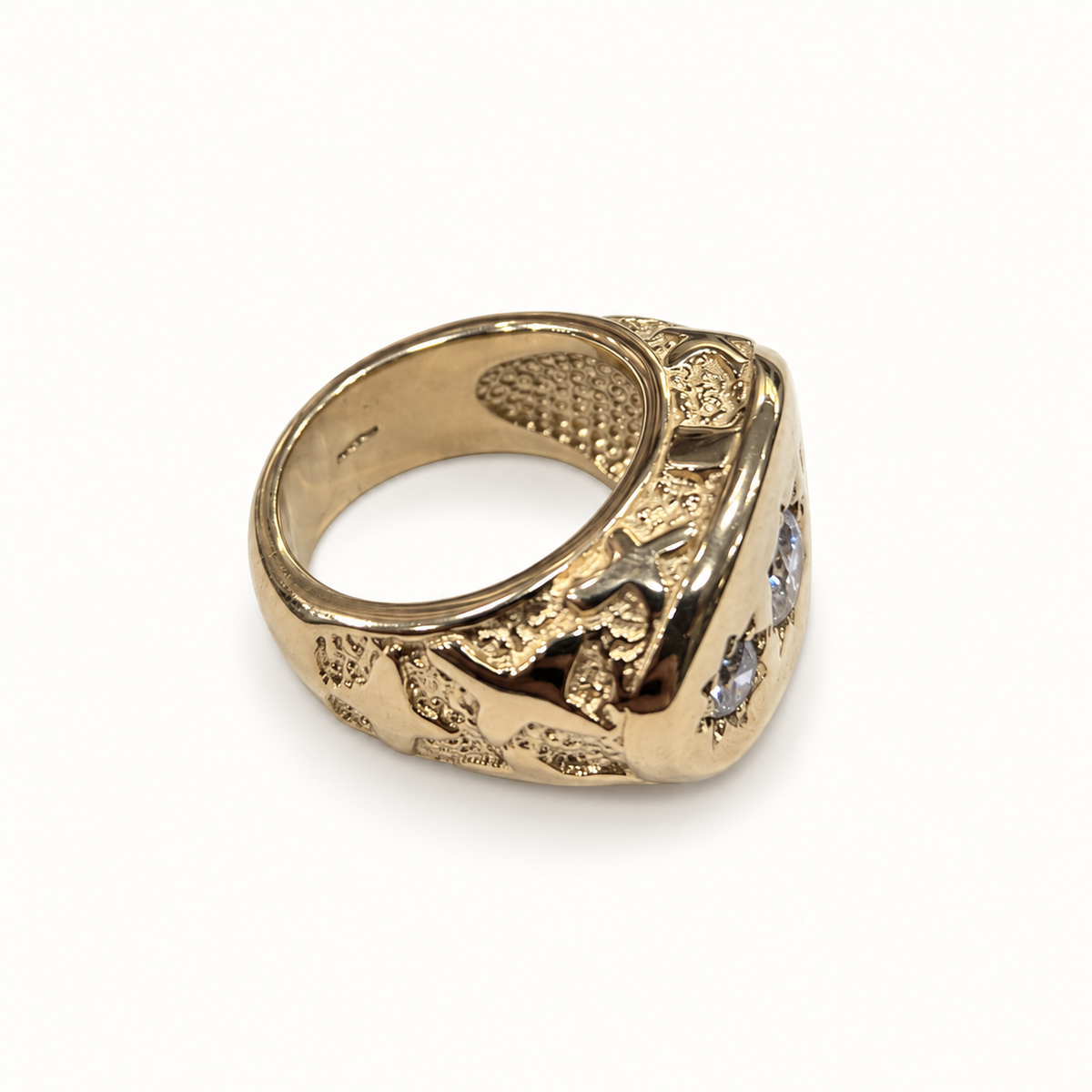 Men's 9ct yellow gold ring, side view on ivory