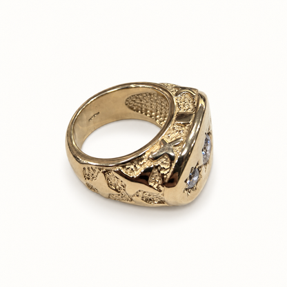 Men's 9ct yellow gold ring, side view on ivory