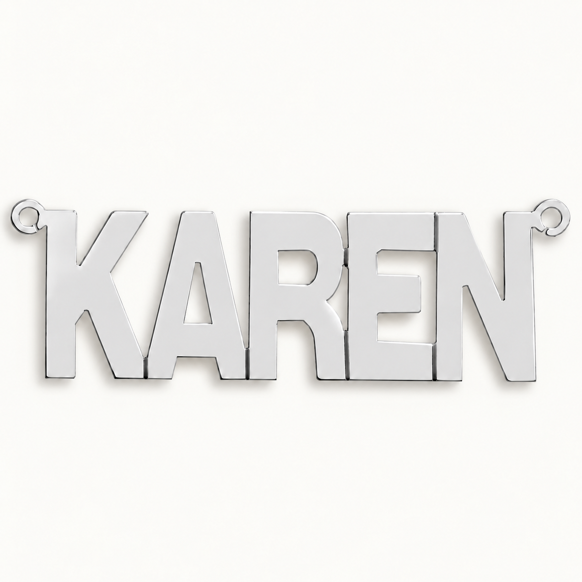 Sterling silver Large Block Style personalised nameplate, example Karen, illustrative image on pale off-white background